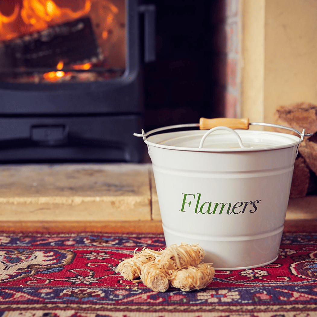 Flamers storage buckets in front of woodburner