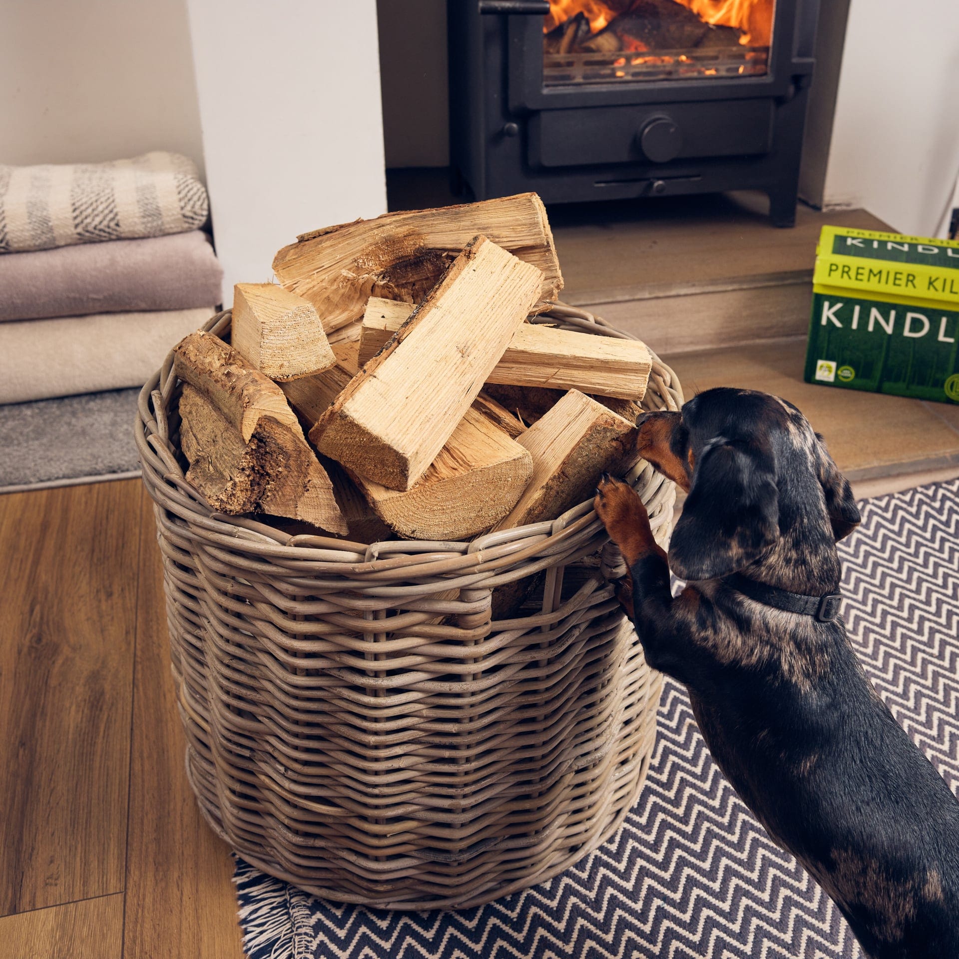 kiln dried logs in log basket for woodburning stoves