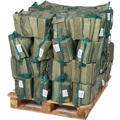 Stack of green mesh bags on a wooden pallet with white labels.