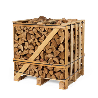 Stack of birch and oak firewood in a wooden crate on a white background