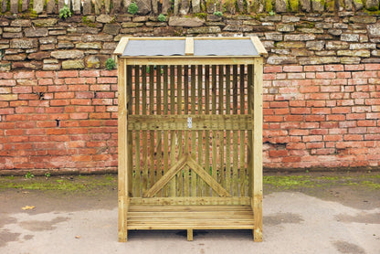 a pressure treated log store with a felt roof empty and ready to be filled with firewood