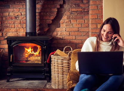lit woodburner with firewood