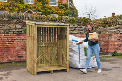 a lady unpacking a bulk bag of firewood to load into her log store