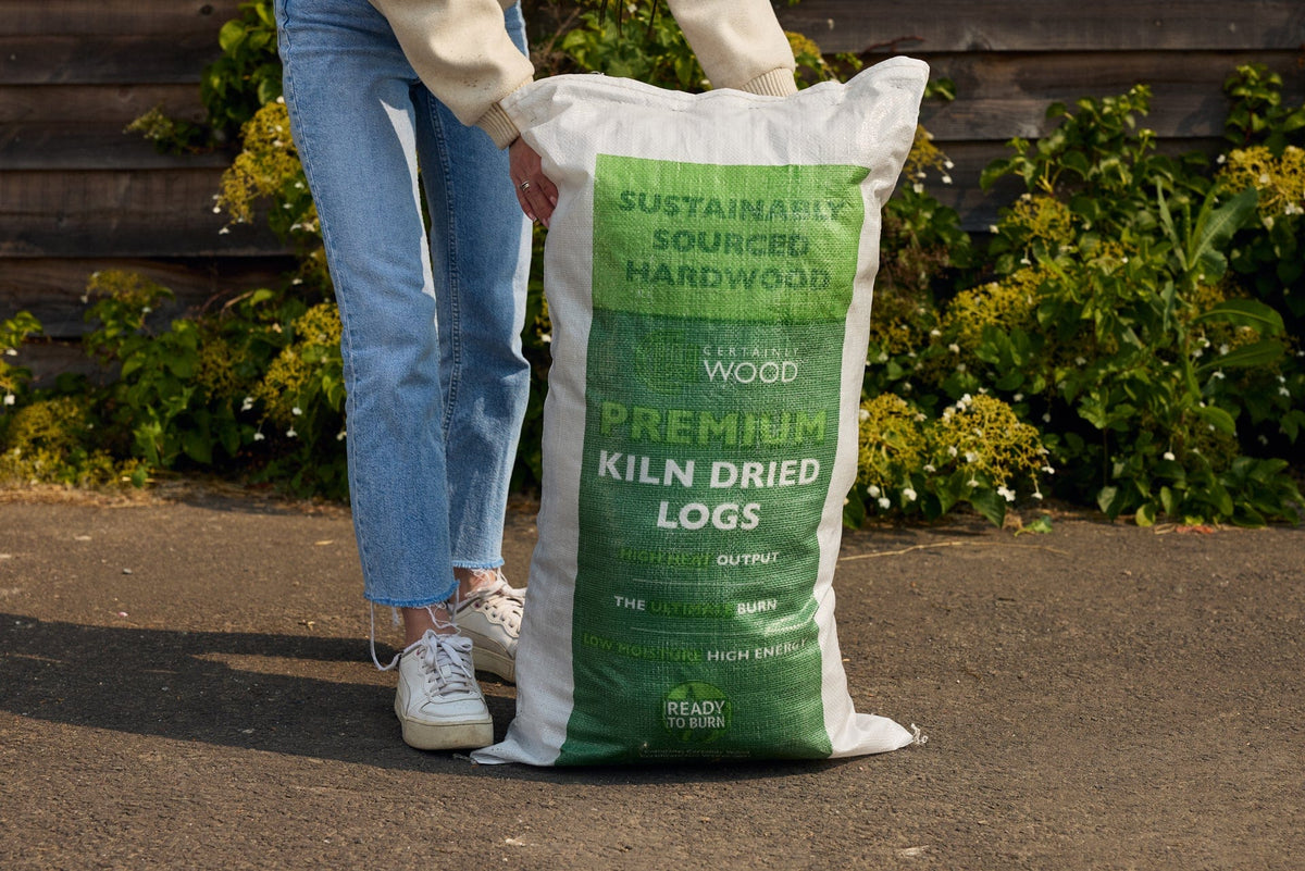 person holding an 18kg boot bag